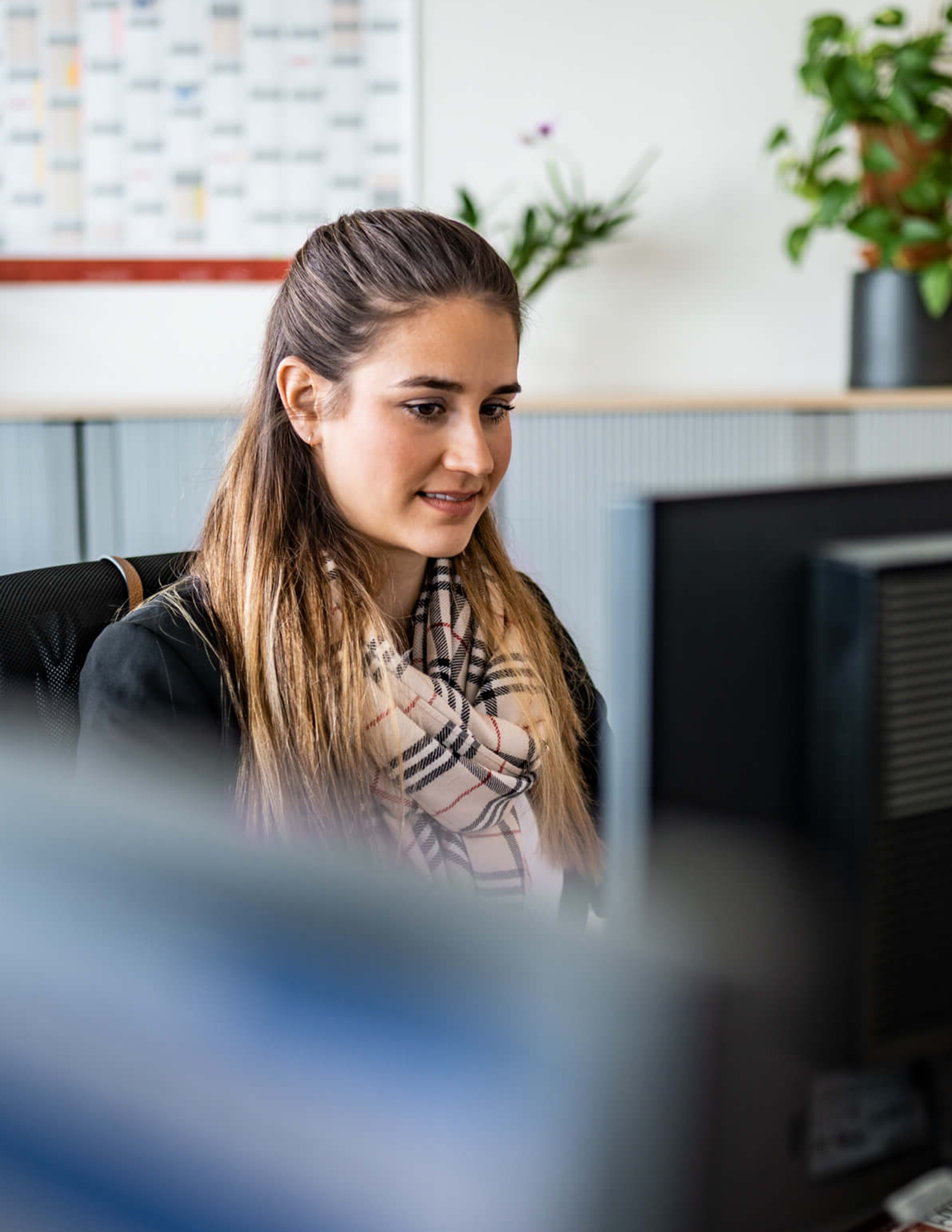 Young woman in front of computer
